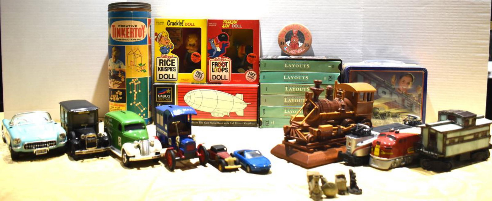 Lot of Toy Train & Collectibles: Lot of Toy Train & Collectibles, Lionel lunch box, Diecast cars, TinkerToy, Avon train display only, VHS cassets for layouts.
