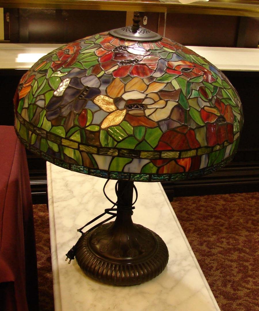 Tiffany Style Table Lamp - Bronze Base: Tiffany Style Table Lamp - Bronze Base, approx. 28"h; shade is 22" diameter. We could not get this lamp to light; it may be a simple fix but right now it does not work.