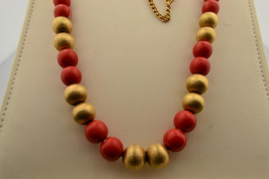 14k yg Mikimoto Gold & Coral Necklace: 14k yg Mikimoto Gold & Coral Necklace in original case. 24 - 8.5mm 14k beads with 22 more Coral beads. Length 18", 40.4gr
