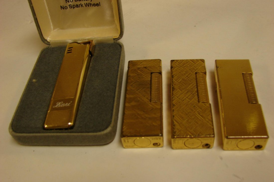 3 Gold Dunhill Lighters & 1 Colibri: 3 Vintage Gold Dunhill Lighters & 1 Colibri in fitted box. Dunhill lighters have lifetime guarantees.