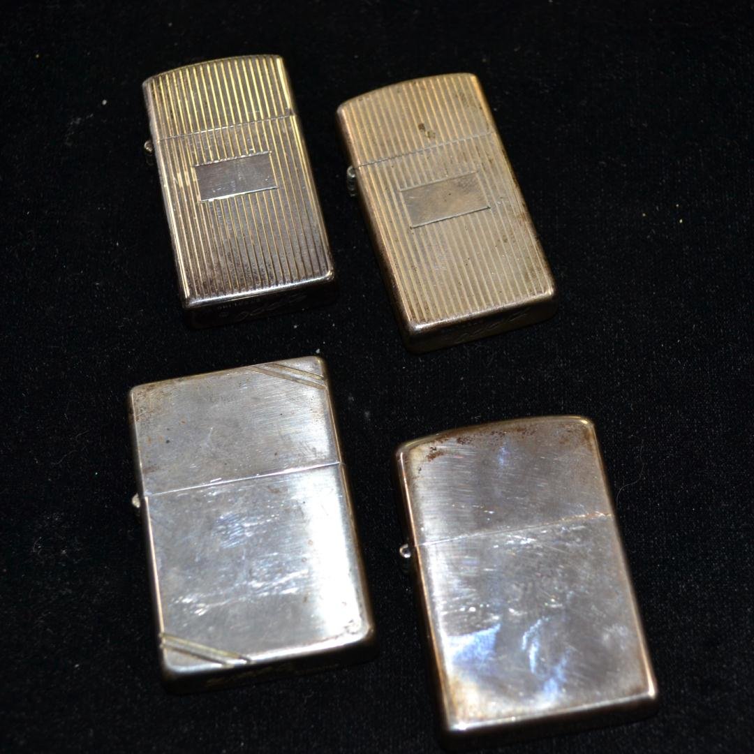 Sterling Silver Zippo Lighters: Sterling Silver Zippo Lighters. Four lighters from the past. You can buy New on line for $200 - $275 EACH. LENGTH 2", 113.8gr