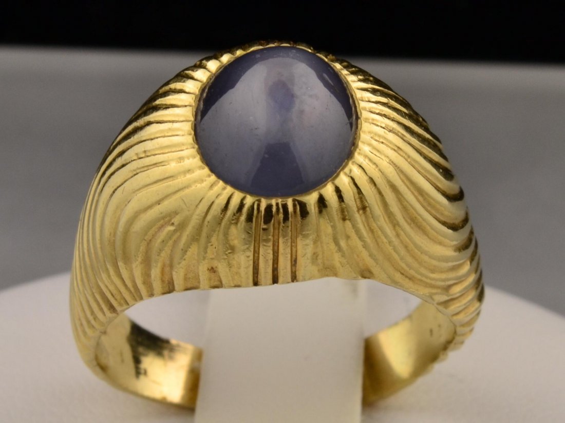 14k yg Mans Star Sapphire Ring: 14k yg Mans Gray Star Sapphire Ring. 8 x 10mm Star Sapphire center stone with swirl design on sides. size 11, 12.9gr