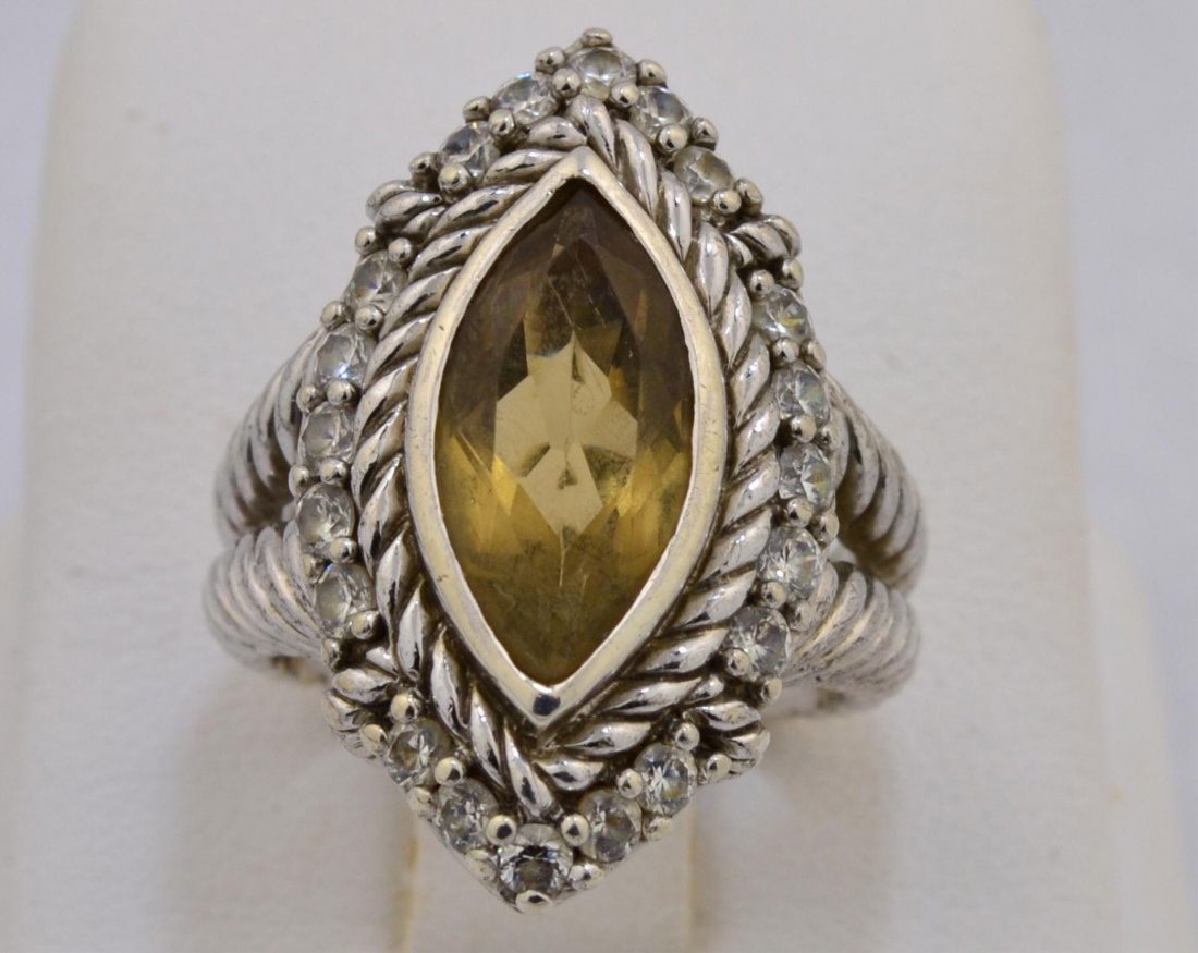 Judith Ripka Ladies Topaz Ring: Judith Ripka Ladies 2ct Topaz Ring. 7 x 13mm marquise cut bezel set in rope design split shank mounting with CZ. size 6, 9.9gr