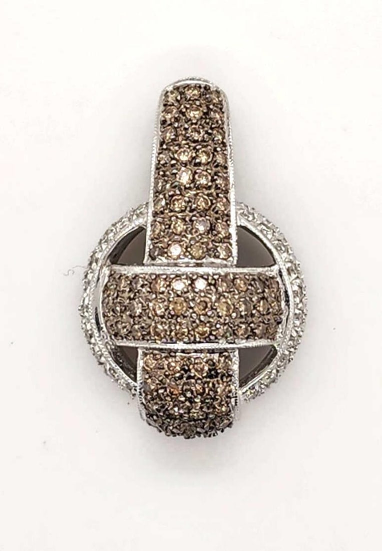 14kt white gold brown and white diamond pendant: Ladies 14kt white gold brown and white diamond pendant featuring a center cross design of prong set round brown diamonds, accented with an outer ring of round white diamonds. Total diamond weight appr