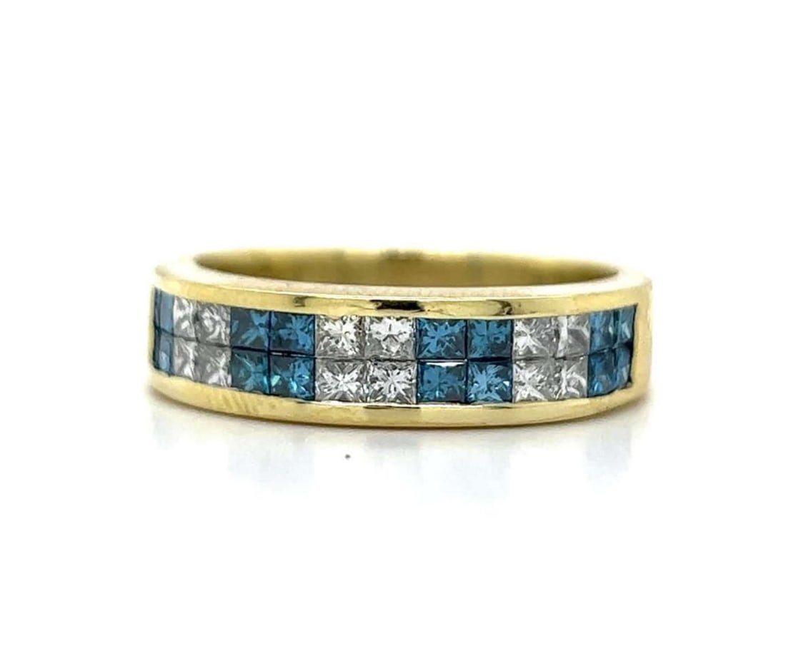 18kt yellow gold blue and white diamond ring: 18kt yellow gold blue and white diamond band featuring invisible set blue and white princess cut diamonds weighing approx. 2.24ct., Clarity VS2-SI2, Color H-I. Width 6mm. Finger size 12. Weight 10.0 g