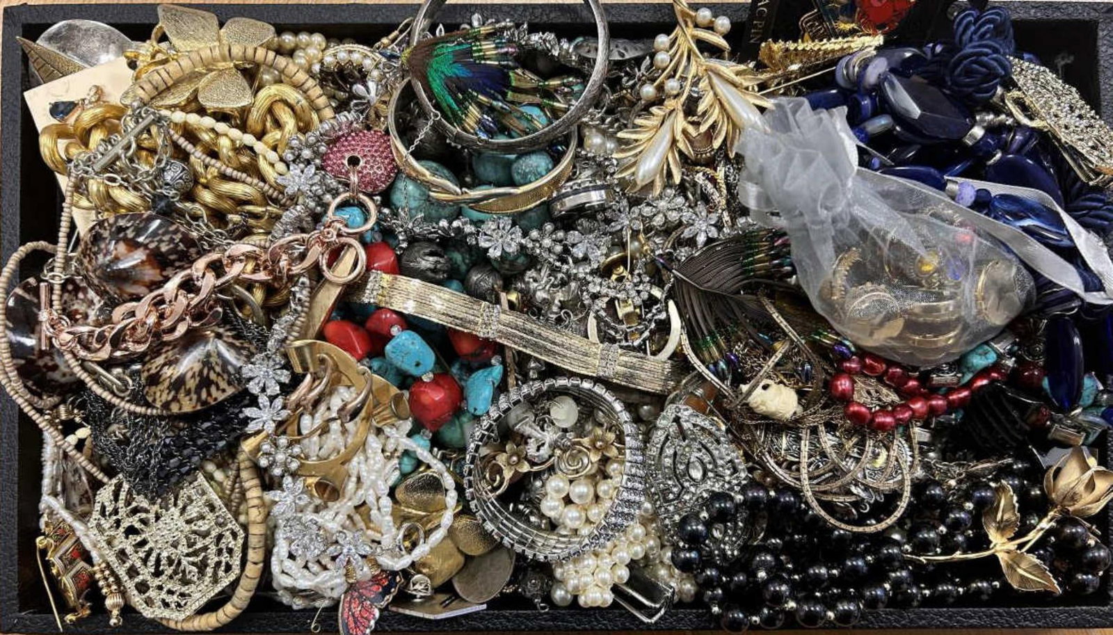 Large lot of costume jewelry: Large lot of costume jewelry including beaded necklaces, Christmas brooches, rhinestone bracelets and matching necklaces, ladies watches, beaded stone bracelets, foe pearls and much more!