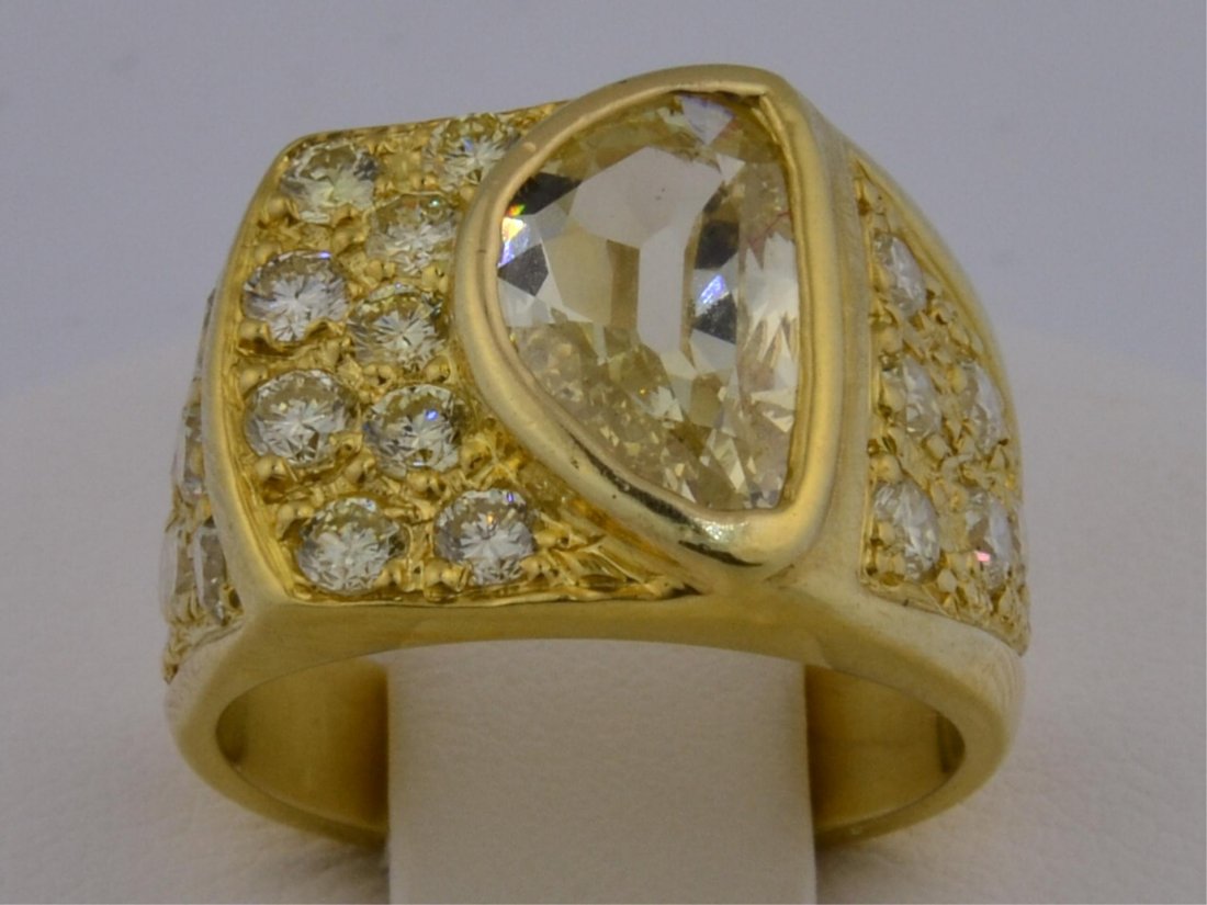 18k yg Mans 2 1/2 ctw Diamond Ring: 18k yg Mans 2 1/2 ctw Diamond Ring. Riverboat Gamblers Ring with Fancy Yellow 1/2 Moon Diamond. Weight is 1.42ct. Clarity SI. 23 side Diamonds weigh 1.15ctw. size 6, 14.5gr
