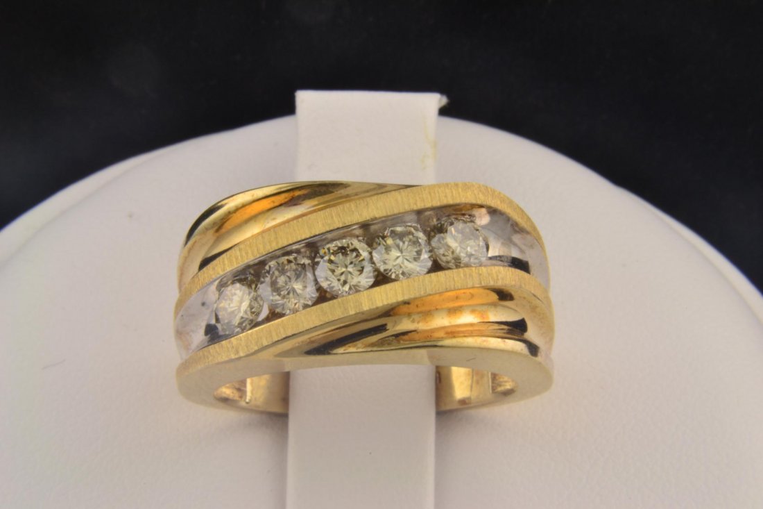 10k yg 1ctw Man's Diamond Ring: 10k yg 1ctw Man's Diamond Ring. Five Champagne Round Brilliant Cut Diamonds channel set. Clarity SI -2, size 10 1/2, 8.3gr