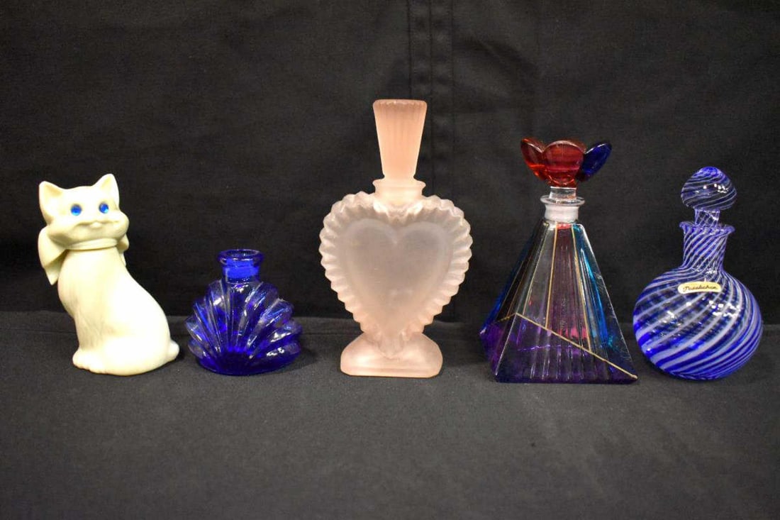 Group Of Perfume Bottles: Group Of Perfume Bottles. Total of 5 in the group. Sizes range from 2 1/2"-5 1/2" tall. Consists of a cat perfume bottle. Seashell perfume bottle(missing the top). Multicolor Pyramid perfume bottle. P