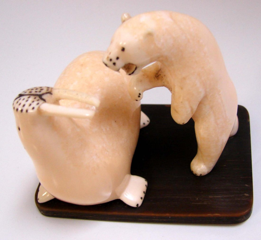 Mammoth or Walrus Ivory Walrus & Bear: Vintage Mammoth or Walrus Ivory Walrus & Bear sculpture, carved in Alaska at least 50 years ago. Stand is 3.5" long x 2.375" wide.