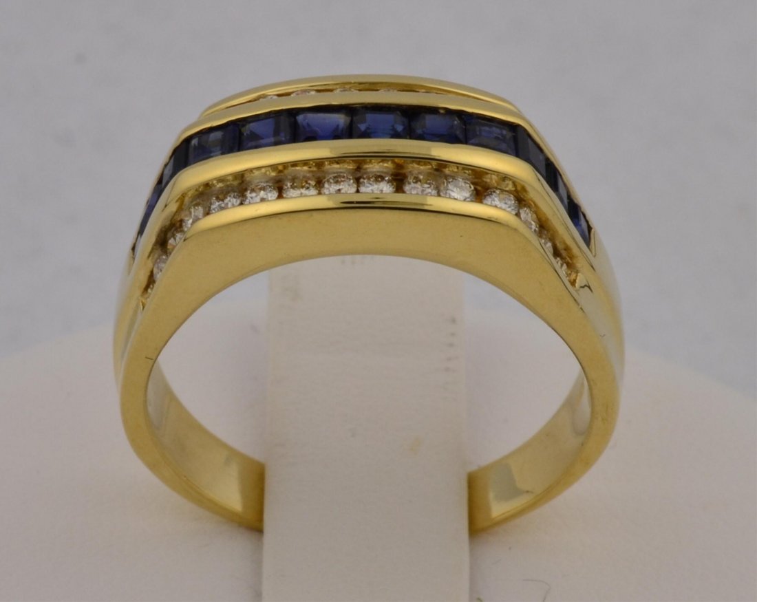 14k yg Mans Diamond & Sapphire Ring: 14k yg Mans Diamond & Synthetic Sapphire Ring. Twelve 2 x 2mm Synthetic Princess Sapphires and Thirty 1.5mm Diamonds Channel set.. .45ctw. Clarity SI, Color H, size 12 1/2, 9.8gr