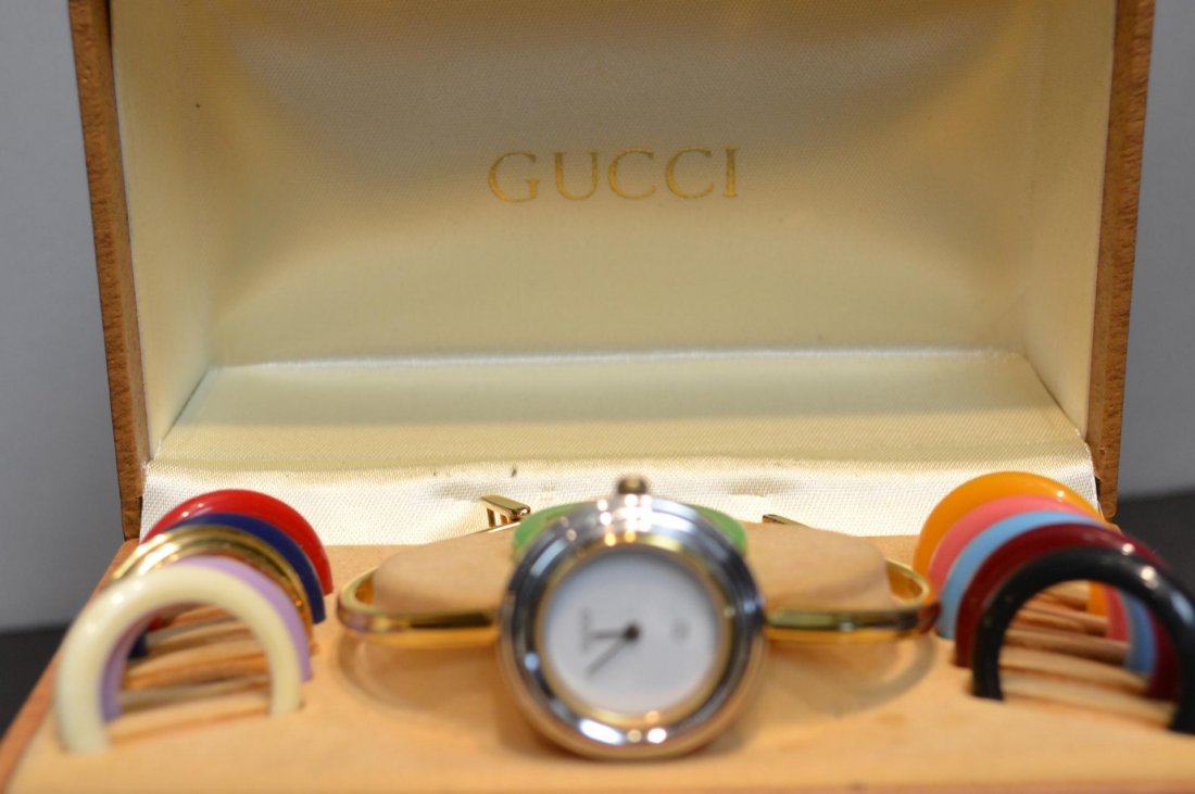 Lady's Gucci Fashion watch: Lady's Gucci Fashion watch with eleven changeable bezels and original box.