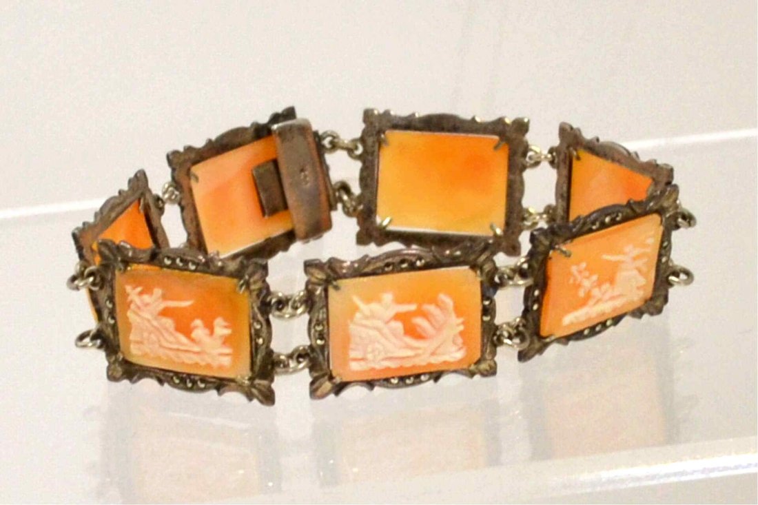 Silver Art Deco cameo bracelet: Carved Art Deco cameo bracelet in 800 silver. Each frame has marcasite accents. 71/2" in length.