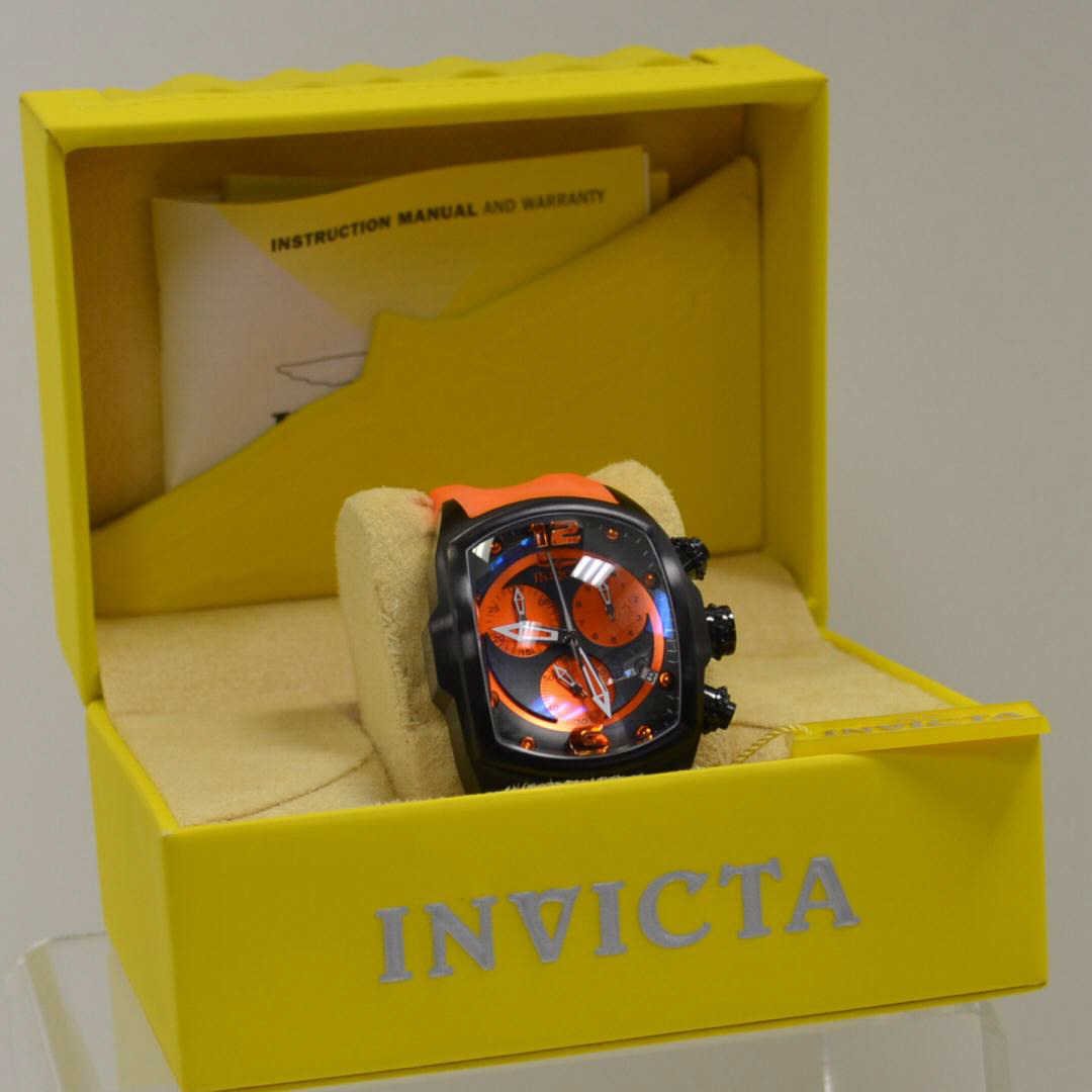 Man's Invicta 6227 Chronograph watch: Man's invicta 6227 Chronograh watch black & orange dial, Swiss quartz movement, water resistant to 330ft, box and manual. Never been worn.