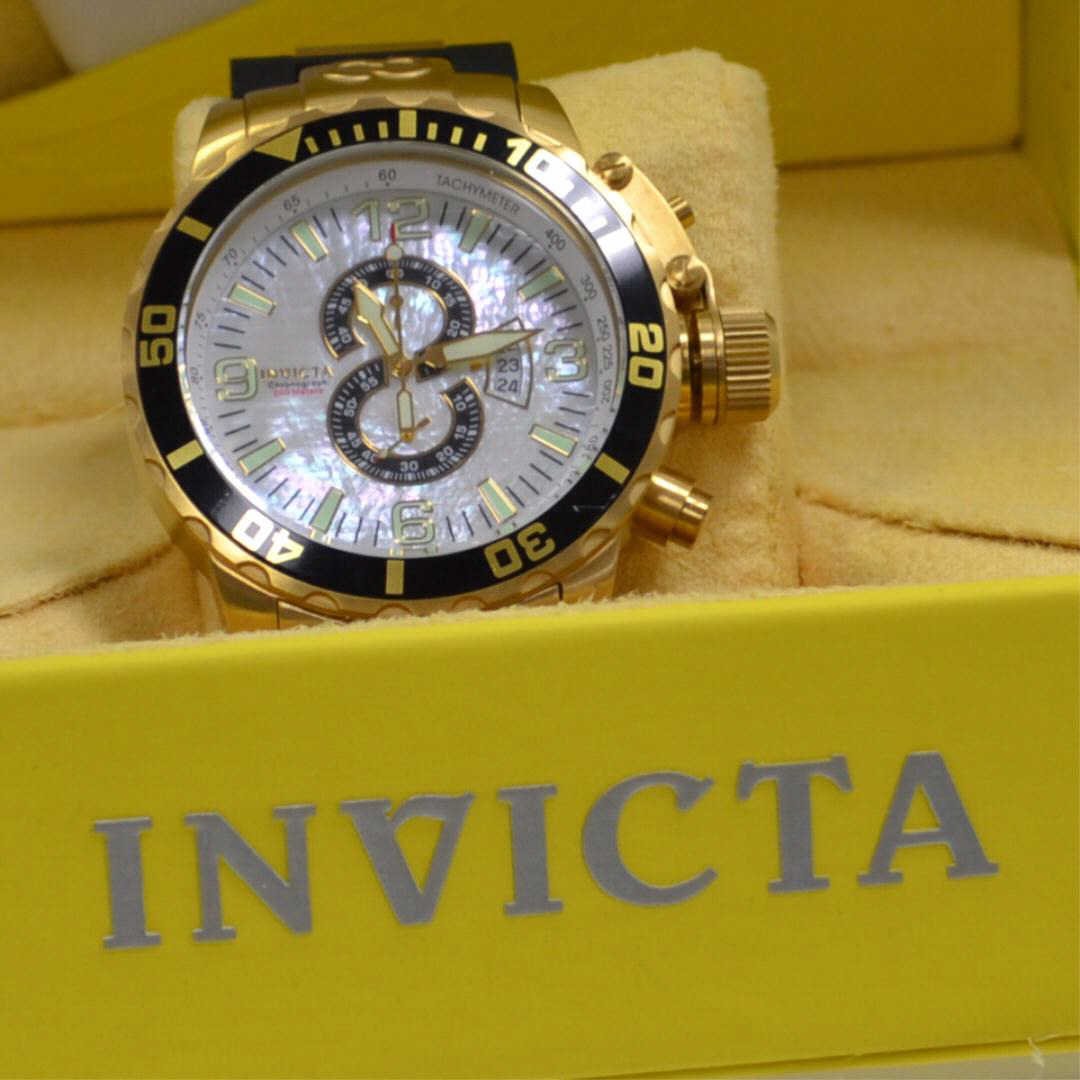 Man's Invicta 4899 Chronograph Dive Watch: Man's Invicta Chronograph model #4899 with mother of pearl dial, water resistant to 200m, gold plating over stainless steel, quartz movement, rubber & stainless band and all papers and box.