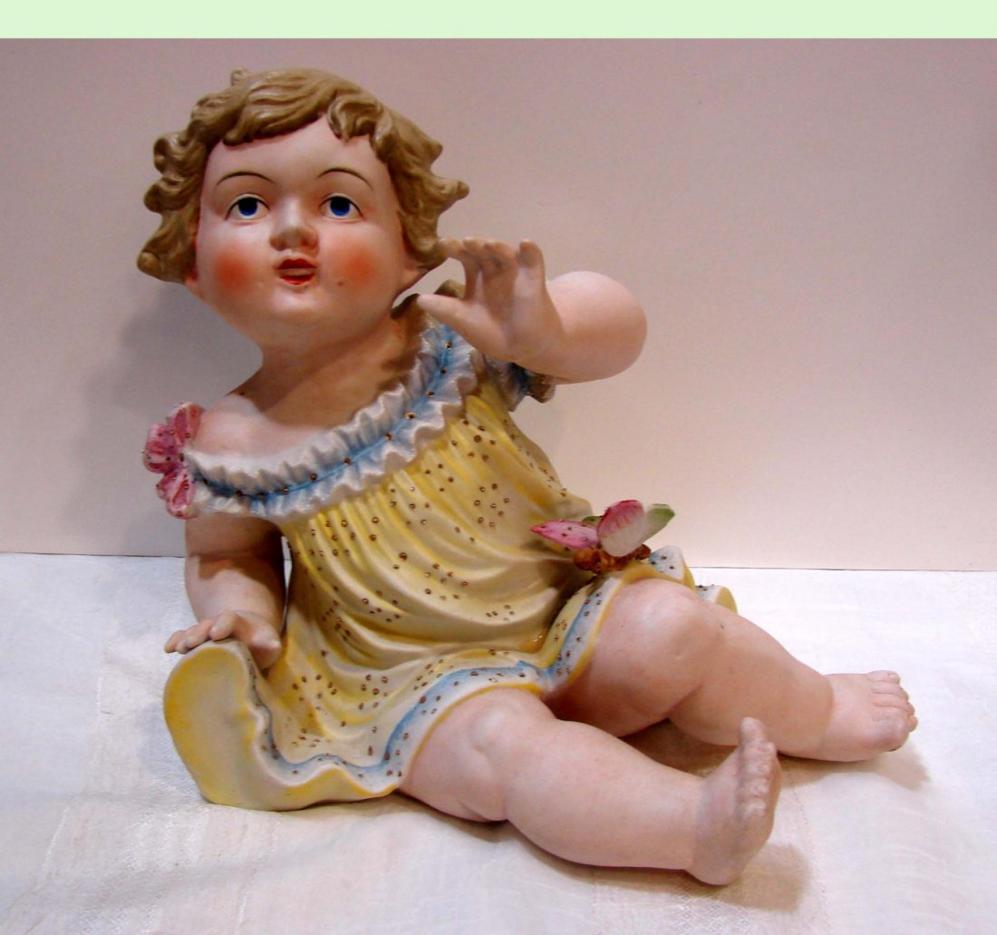 German Bisque Piano Baby, probably Heubach: German Bisque Piano Baby, probably Heubach, 8 1/2" tall, marked 32/107 on bottom; probably Heubach.