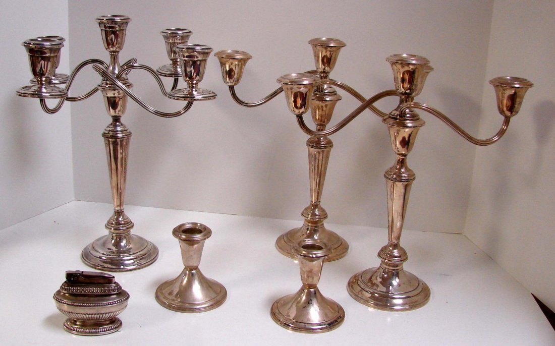 Lot of Sterling Candelabra: Lot of sterling silver consisting of a 5 arm sterling candelabra, a pair of 3 arm caldelabra, both Gorham, a pair of single candleholders by Alvin (all are weighted) and a Ronson Queen Anne Lighter, a