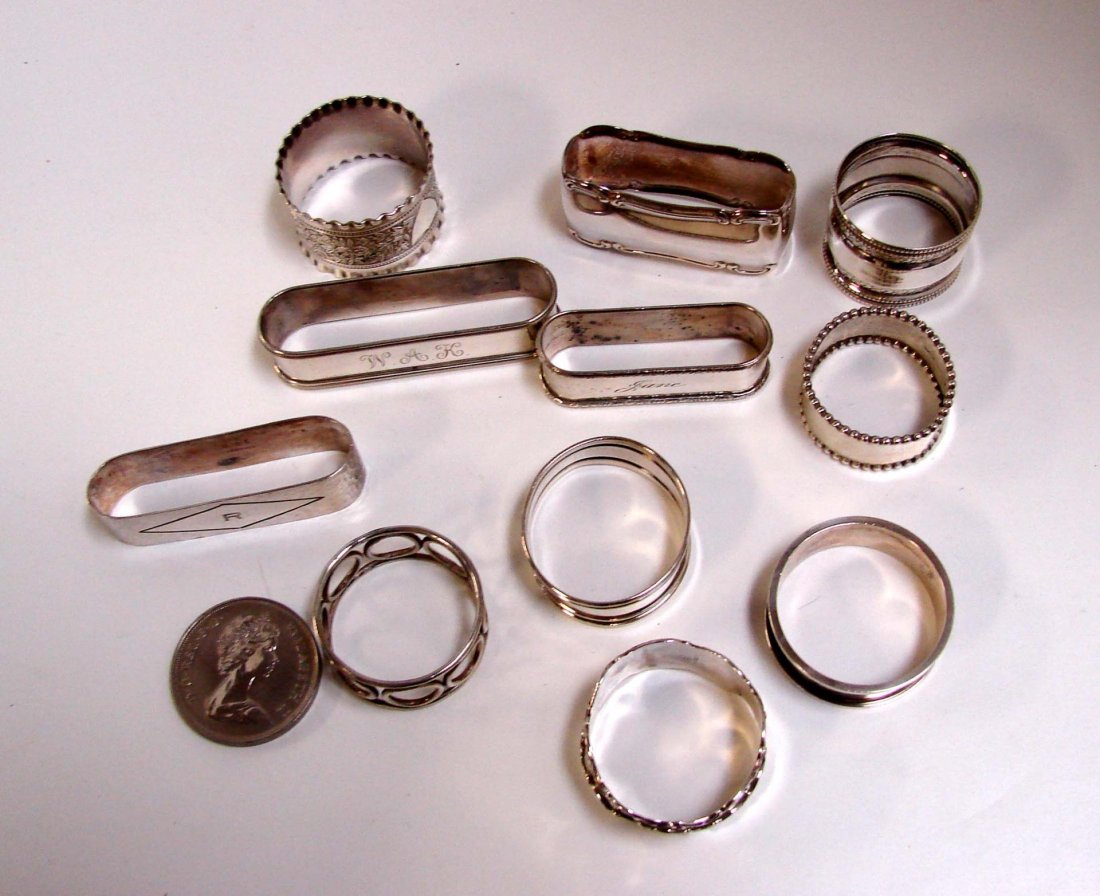 11 antique sterling silver napkin rings: 11 antique sterling silver napkin rings, 6.5 oz., and a Queen Elizabeth memorial medal.