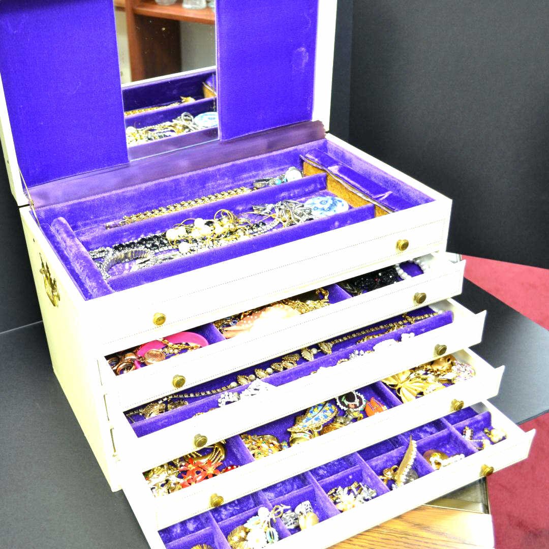 Jewelry Box of Costume Jewelry: Large jewelry box of costume jewelry along with tray of rings, bracelets earrings, pins and much more.