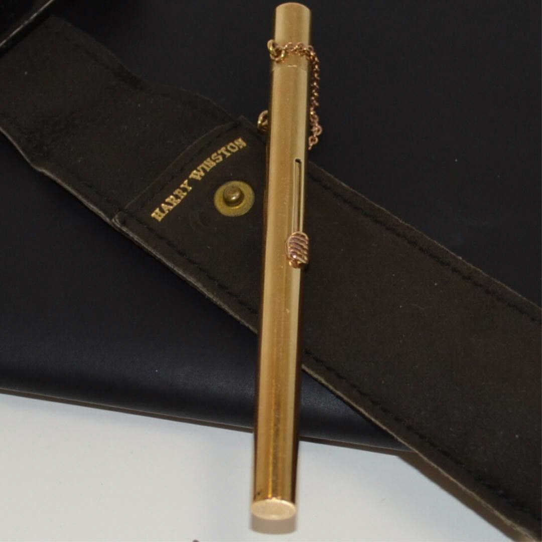 14kyg Lipstick Applicator by Harry Winston: 14kyg lipstick applicator by Harry Winston, 33/4" in length, 1/4" in diameter with pouch. 15gm