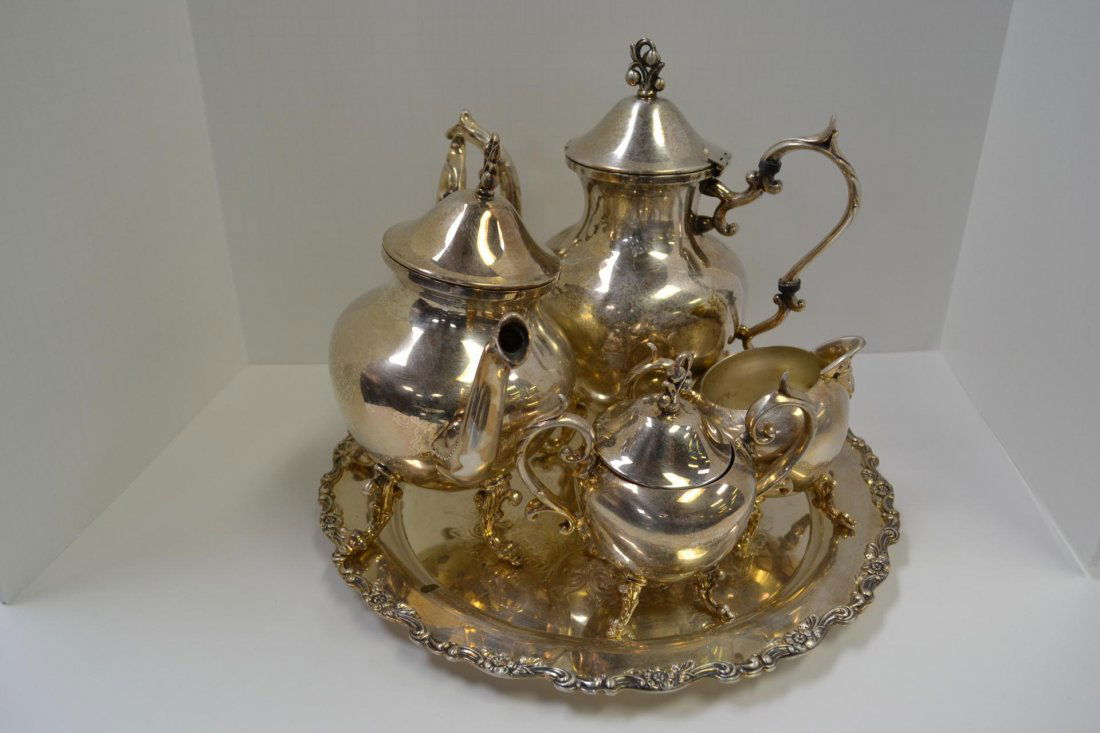 5 Piece Silver Plate Coffee and Tea Service w/Tray: 5 Piece Silver Plate Coffee and Tea Service with Tray. Tray (15" D) Marked Wm. Rogers, Coffee Pot (12" H), Teapot (11" H), Sugar with Lid (7" H), and Creamer (5" H).