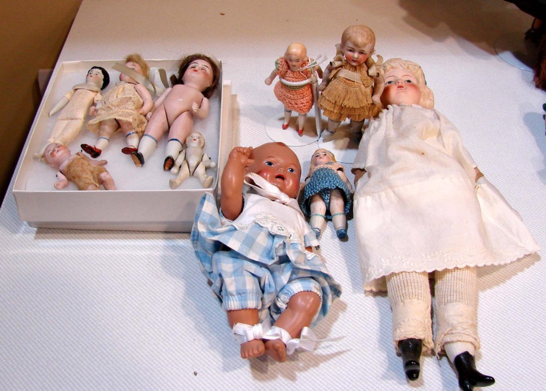 Lot of 8 Antique German Tiny Dolls, Nippon doll: Lot of 8 Antique German Tiny Dolls, ranging from 2" to 4.5". 10" doll marked Nippon, sm. plastic doll in blue outfit.