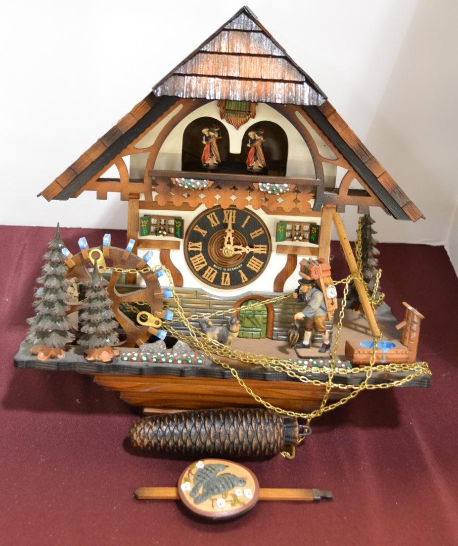 Romance 3883 German Figural Musical Cuckoo Clock: Swiss Romance #3883 Made in Germany Figural Musical Cuckoo Clock. Features Christmas Trees, a Tub & Shower, Ladder, etc. Plays Edelweiss/Der Frohliche Wanderer (Happy Wanderer). Measures 15.5" W x 16"