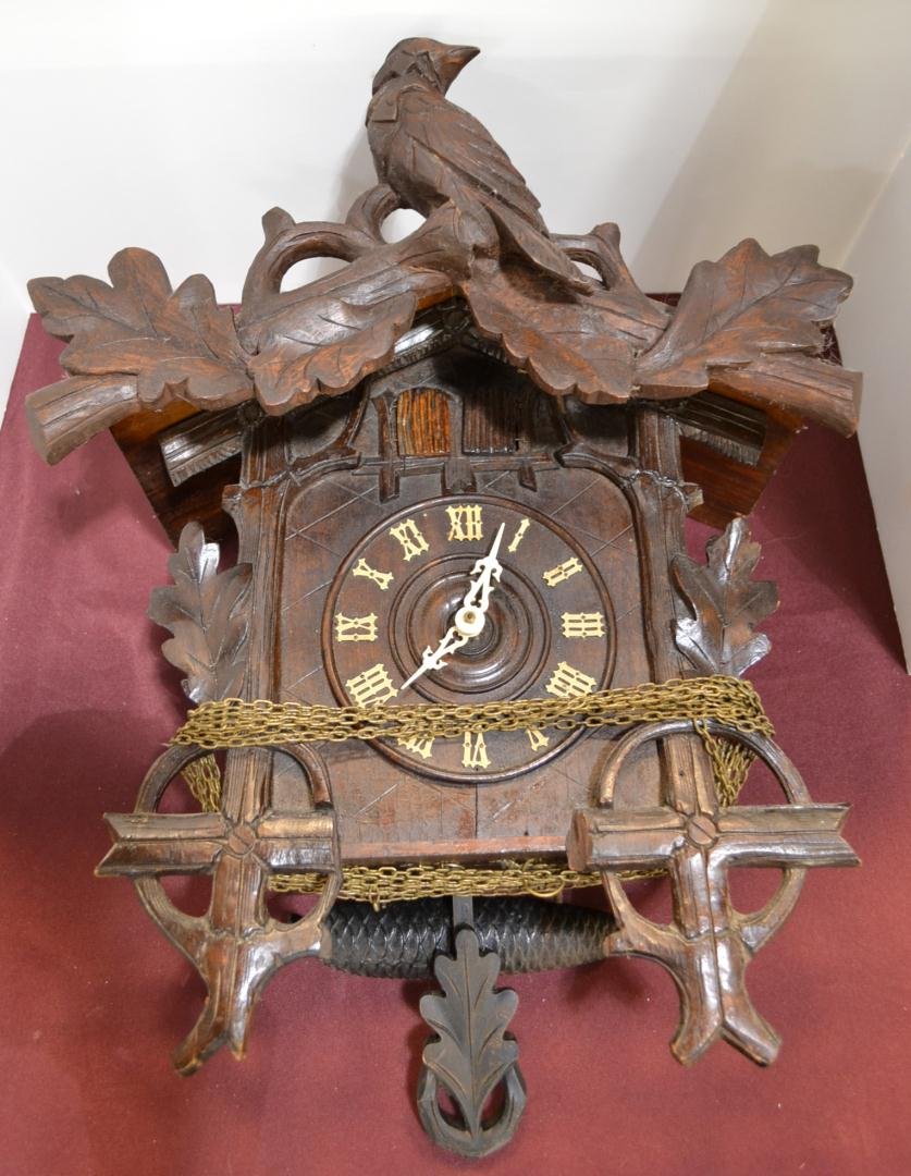 Wood Black Forest Type Cuckoo Clock: Wood Black Forest Type Cuckoo Clock with birds, leaves, and 2 ship wheels? Measures 16"x20" Untested.