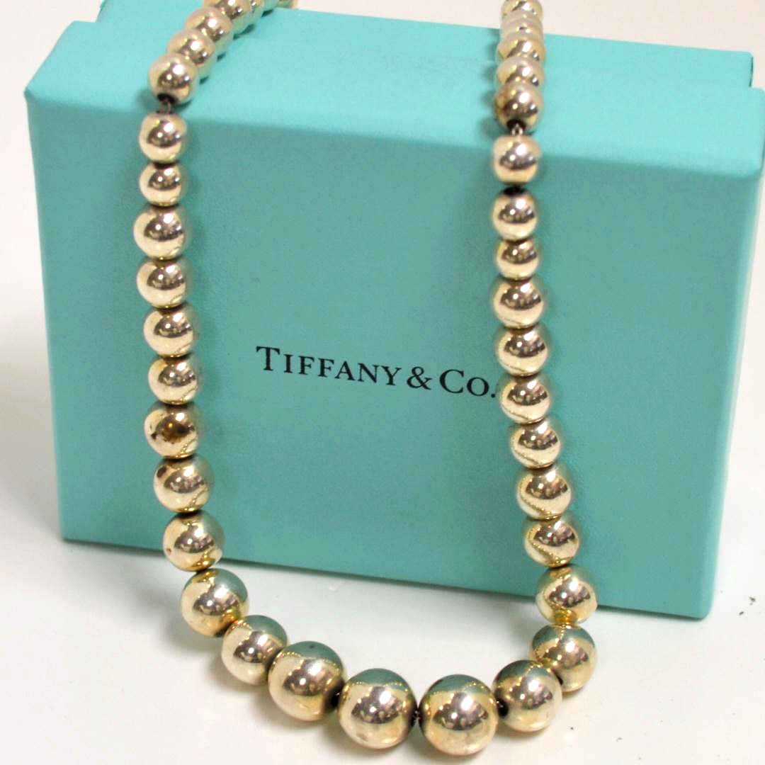 Sterling Necklace by Tiffany & Co: Sterling necklace with graduated silver balls 6-11mm, 16" in length with lobster clasp by Tiffany & Co. 28gm