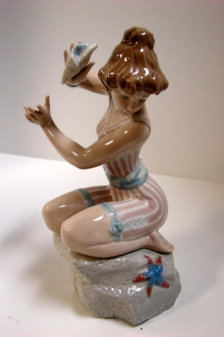 Lladro Girl in Bathing Suit "Startled" #5614: Lladro Girl in Bathing Suit "Startled" #5614, 9" tall; issued 1989; retired 1991; original box (with straw packing).