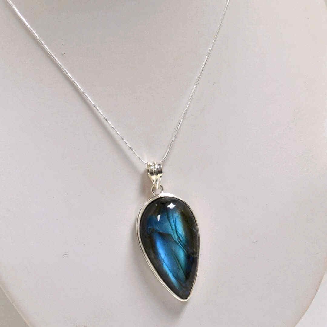 Pear Shaped Labradorite Necklace in Sterling: Large pear shaped blue fire labradorite measuring 2x1 bezel set in sterling with 18" snake chain."