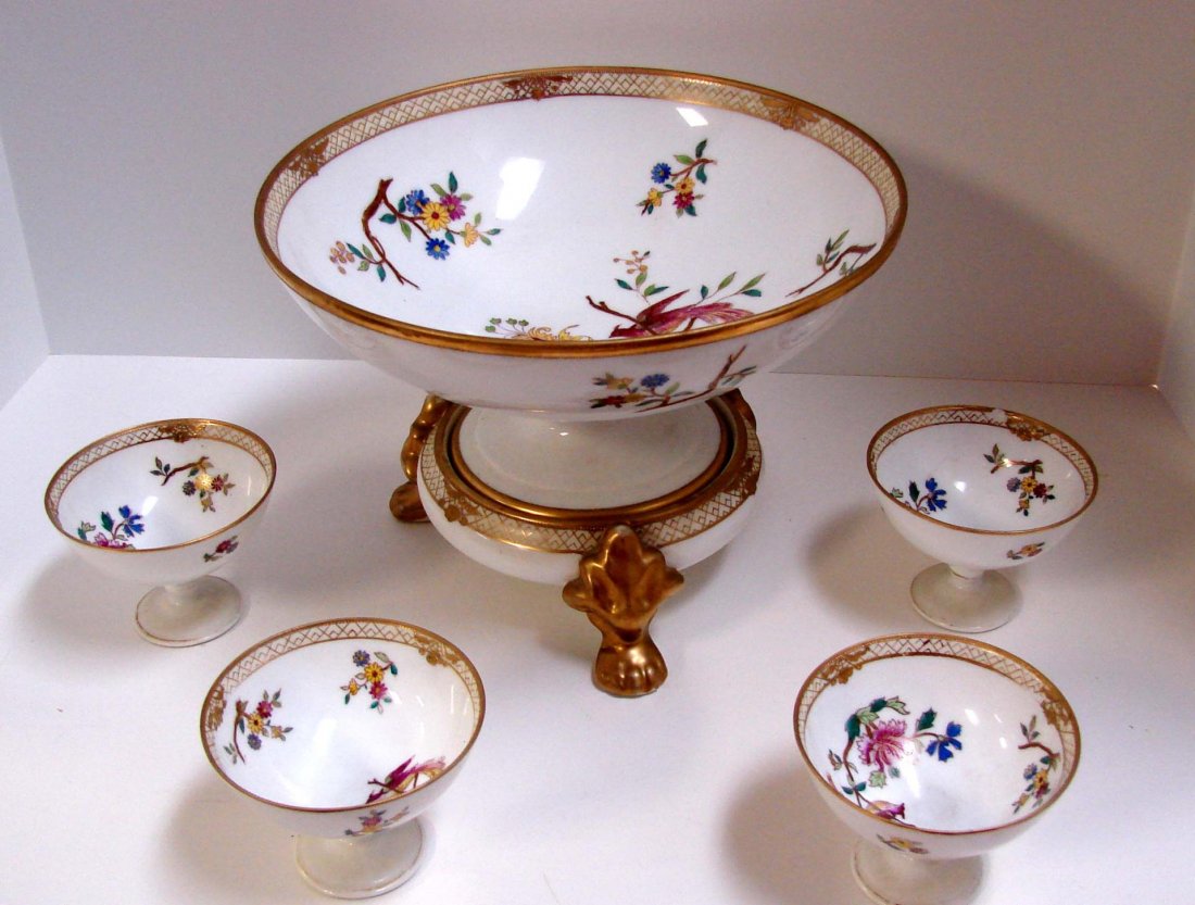 Nippon 2 pc. Centerpiece Bowl & 4 footed bowls: Nippon 2 piece Centerpiece Bowl, 10 dia. with gold rim and floral and peacock decoration, 7" high on stand, no chips, & 4 matching footed bowls 2 3/4" high; small chip on one bowl, see photo. M in wre
