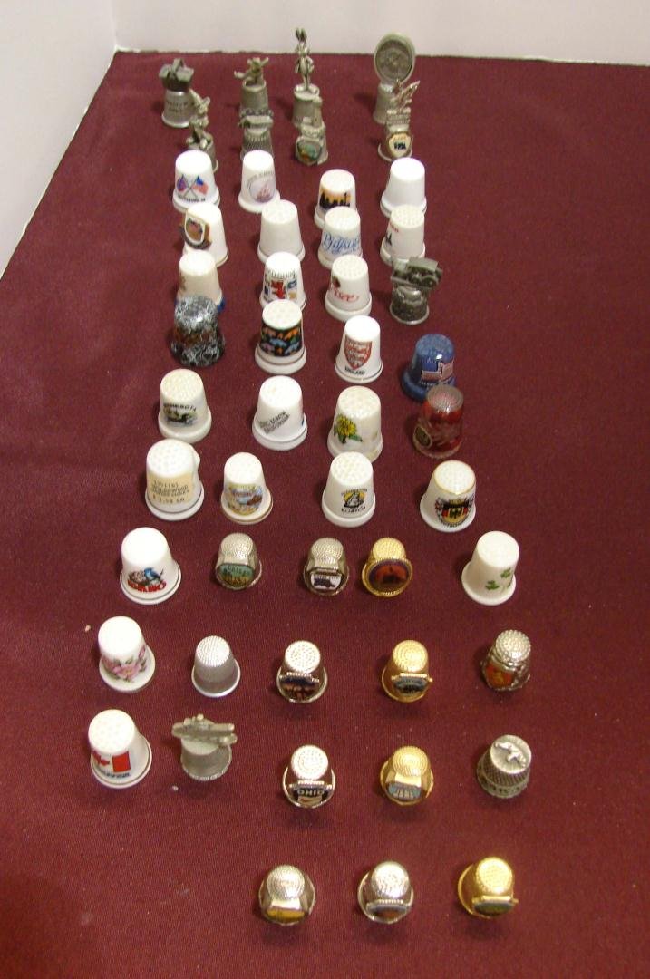 Collection of 52 Thimbles: Collection of 52 Thimbles, including several Disney characters in pewter.