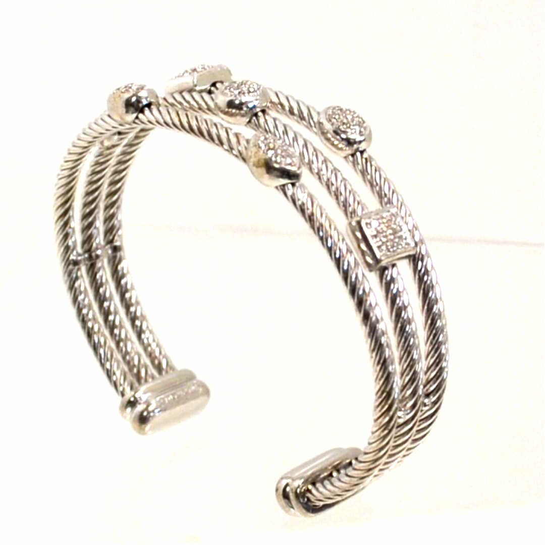 David Yurman Diamond Icicle Bracelet: David Yurman sterling icicle cuff bracelet with 3 rows in a cable design with pave diamonds in oval and square shapes. 33.7gm