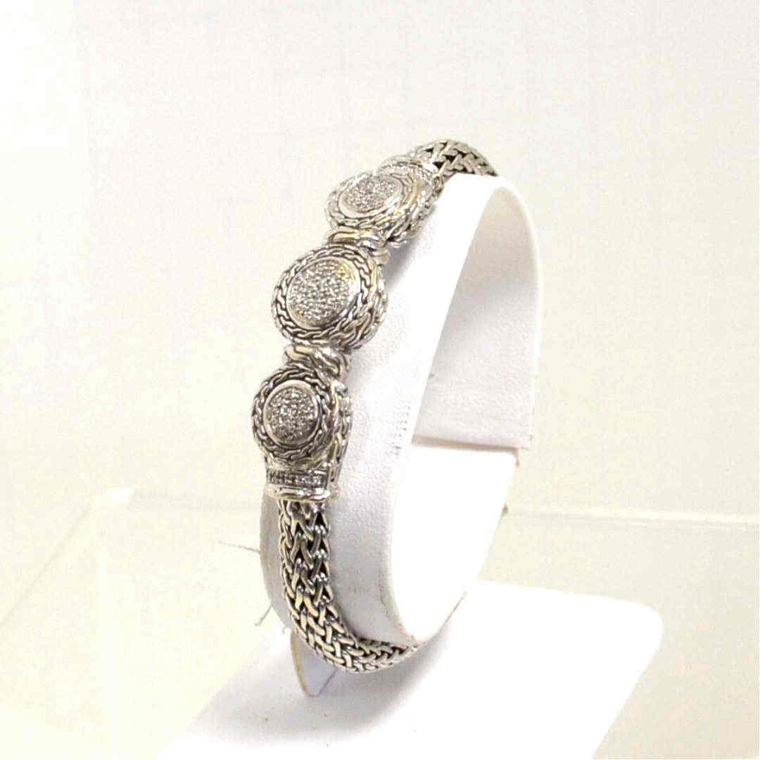 Sterling John Hardy Trio Diamond Bracelet: John Hardy sterling diamond bracelet with carved bracelet chain along with the diamond trio weighing .34ctw. 71/4 in length"
