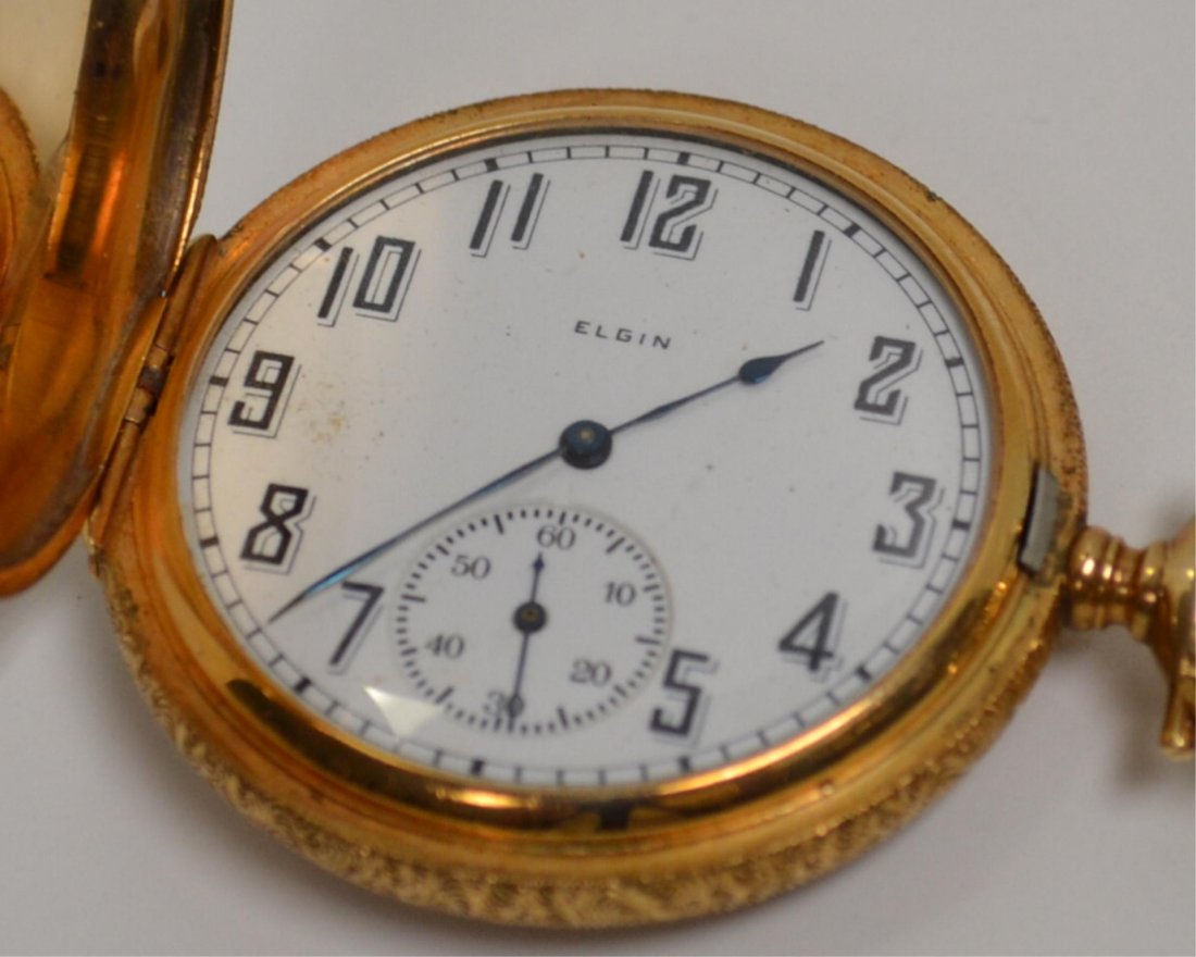 14kyg Elgin Pocket Watch: 14kyg Elgin pocket watch with white dial and second hand, 15 jewel movement and bird and barn motif. Comes with fob and knife. Needs little movement work.