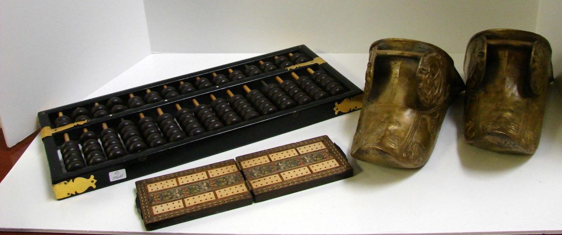 Chinese Abacus & a Pair of Brass Stirrup Shoes: Chinese Abacus, a Pair of Brass Stirrup Shoes, decorated with horses heads, and an antique cribbage game with original pins.