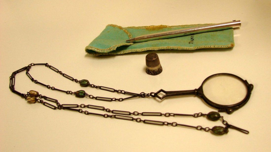 Tiffany Pen, Victorian magnifying glass necklace: Tiffany Sterling SilverPen, Victorian magnifying glass necklace, and a sterling silver thimble.