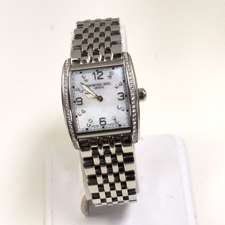 Lady's Stain. Raymond Weil Diamond Watch: Lady's stainless Raymond Weil Don Giovanni watch with mother of pearl diamond dial, diamond case, water resistant, sapphire crystal and good condition.