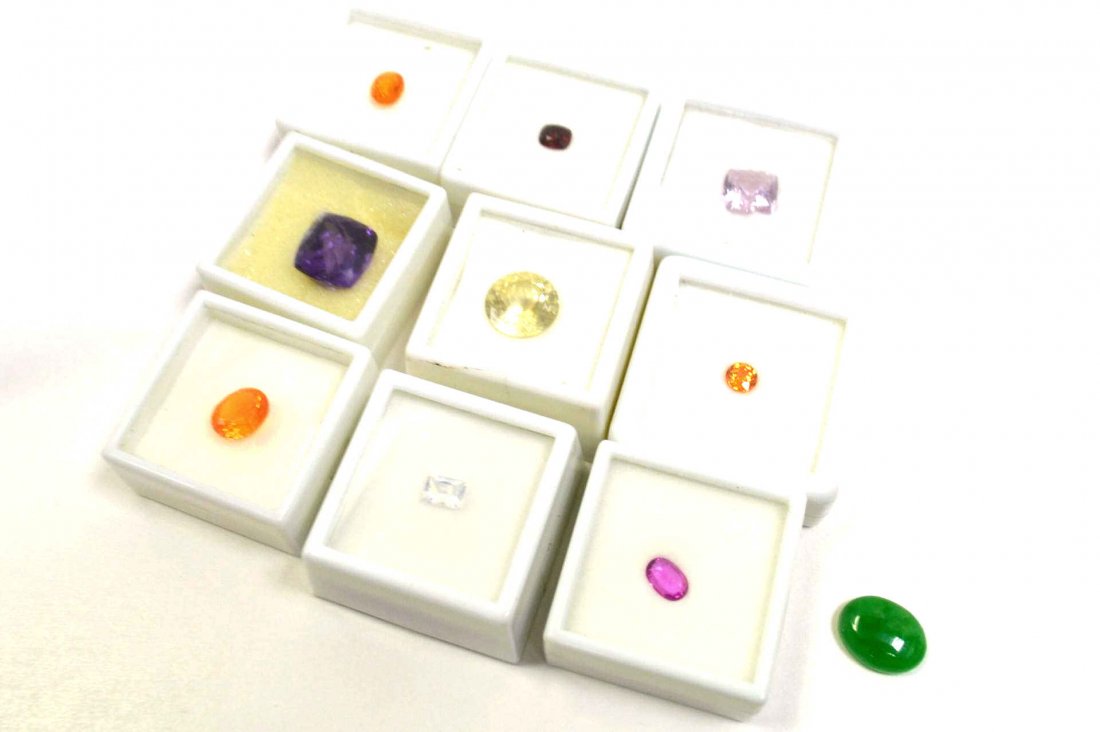 Lot of 10 Colored Stones: Lot of 10 colored stones with amethyst, fire opal, ruby, yellow labradorite, pink topaz and more.