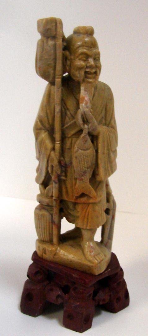 Carved Soapstone Chinese Fisherman: Carved Soapstone Chinese Fisherman, 8" tall including wooden base, with fitted silk lined box.