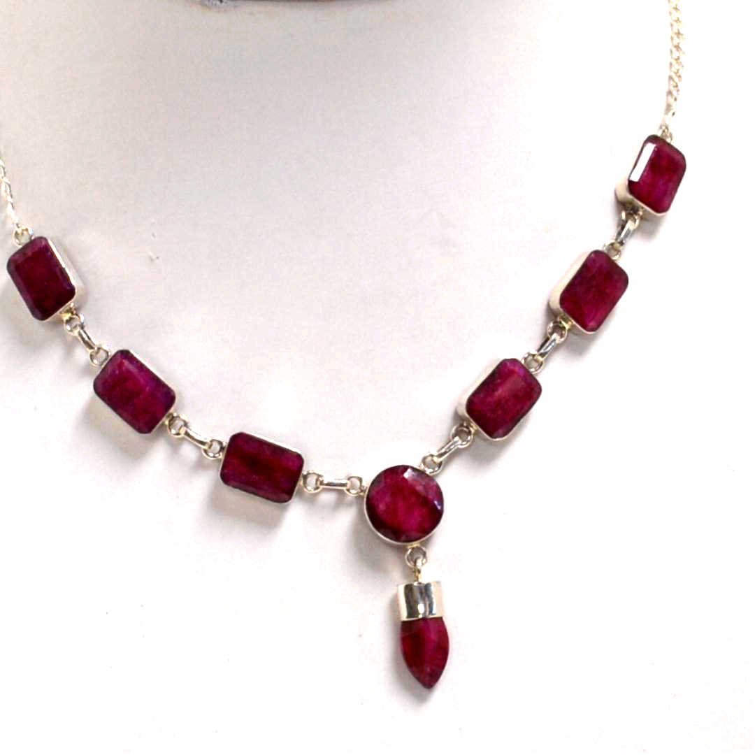 124ct Opaque Ruby Necklace in Sterling: Natural opaque ruby necklace in sterling with emerald and round rubies, bezel set with bullet drop weighing 124ct and adjustable clasp.