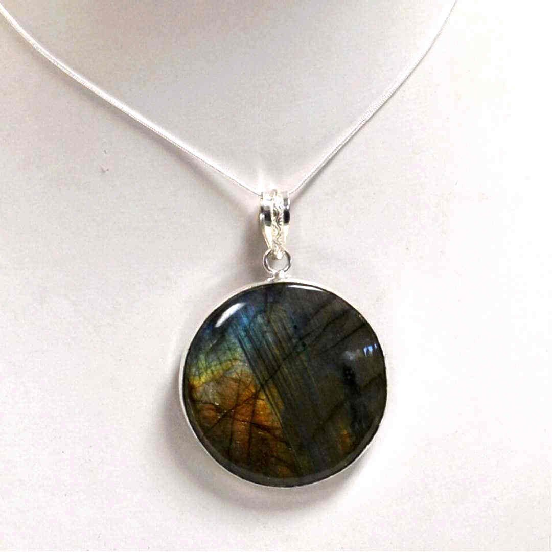Blue Fire Labradorite Necklace in Sterling: Blue Fire Labradorite necklace in circular design measuring 2" in diameter, bezel set with 20" sterling snake chain.