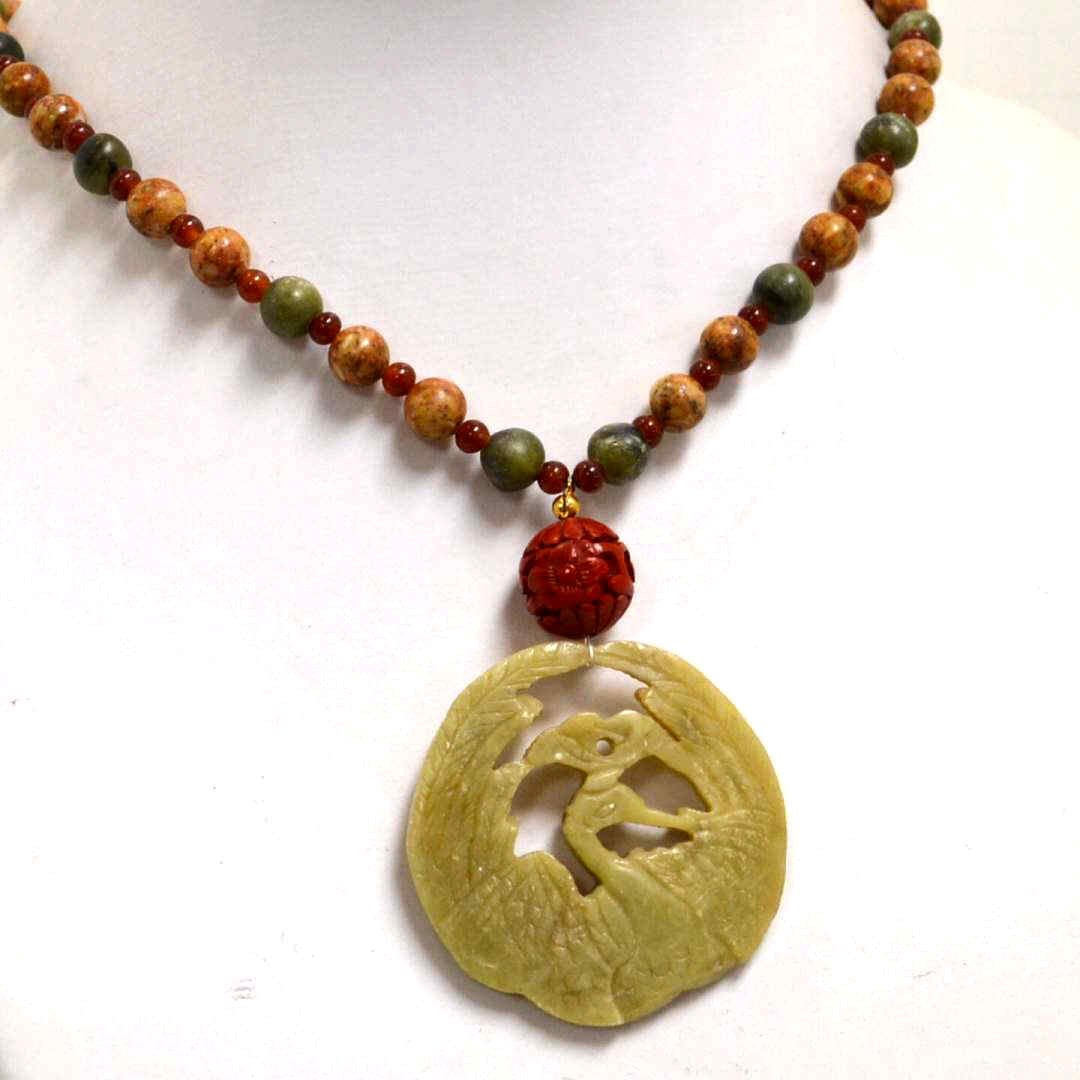 26 Strand Of Jade & Jasper Beads": 26 jade and jasper bead necklace with 9mm jasper along with jade and carnelian beads and 2" carved jade bird medallion."