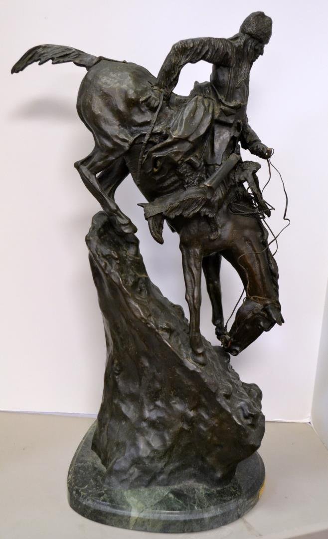 Remington Mountain Man Bronze Statue 28" tall: Bonze Statue - Mountain Man by Frederic Remington. Cold cast bronze. Attached to an oval marble base. The bronze is signed and copyrighted by the artist. 28" tall.