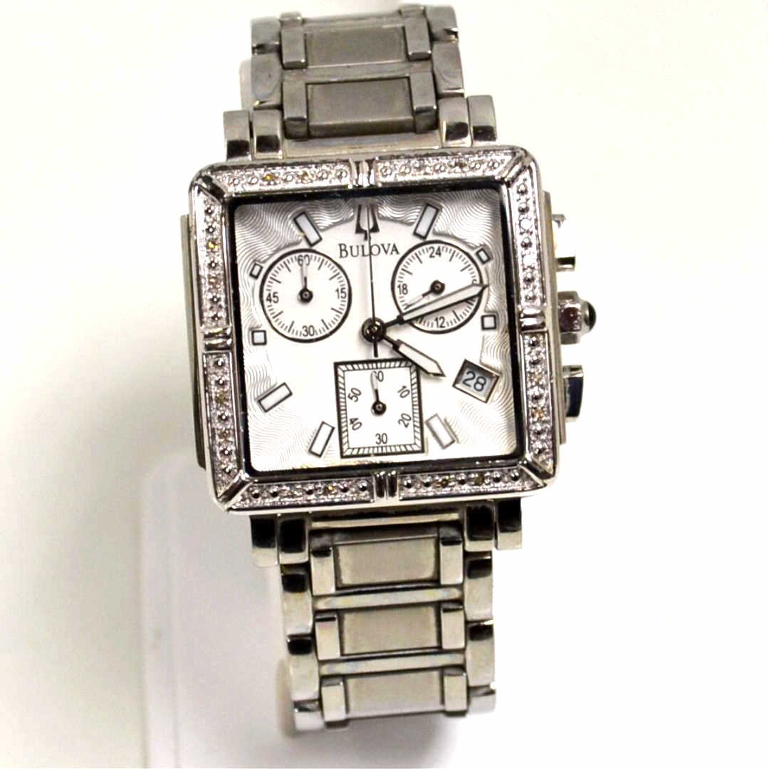 Stainless Bulova Chronograph Watch 96R000: Stainless Bulova model # 96R000 chronograph dial with date, diamond bezel, quartz movement, water resistant and good running condition. Has some scratches.