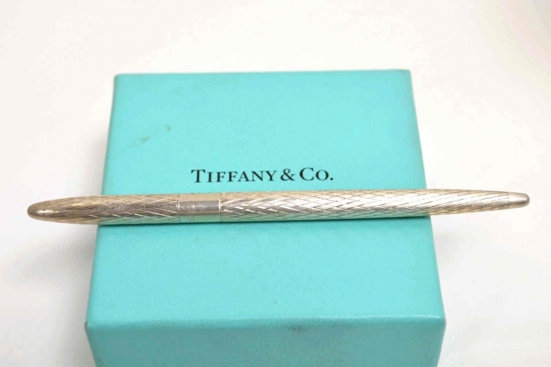 Sterling Writing Instrament Tiffany & Co: Sterling writing pen by Tiffany & Co in the diamond pattern, 41/2" in length.