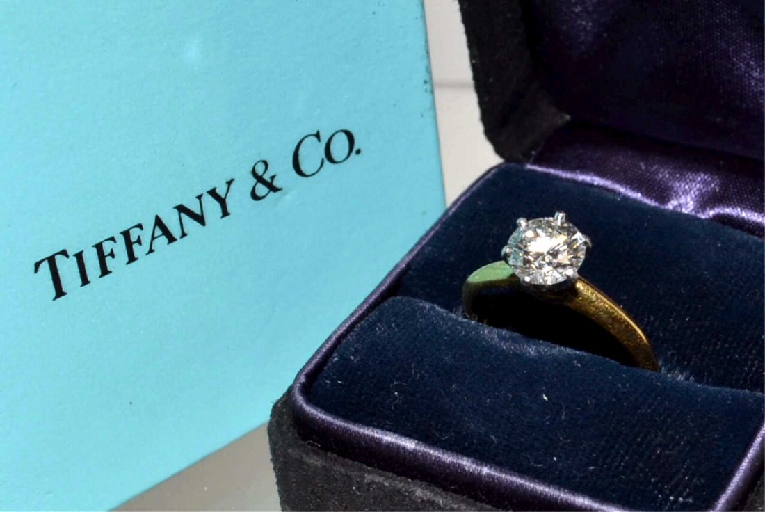 1.10ct Tiffany Round Diamond Ring I/VS2 GIA: 18kyg and platinum engagement ring from Tiffany & Co with 1.10ct round brilliant cut diamond clarity VS2 and I color with good to very good polish and symmetry and no fluorescence, finger size 6. GIA 