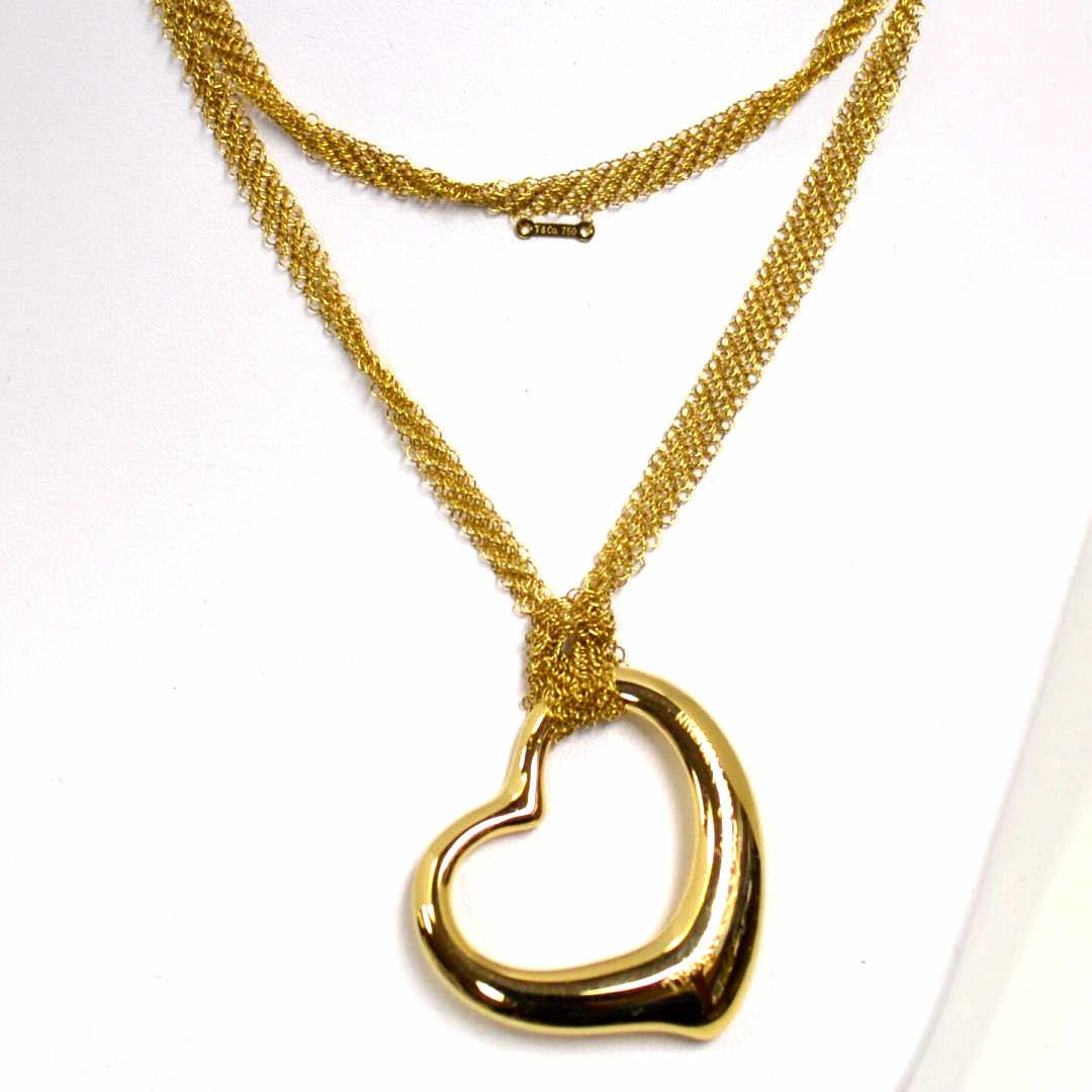 18kyg Heart Necklace Elsa Peretti For Tiffany: 18kyg open heart necklace designed by Elsa Peretti for Tiffany & Co measuring 11/4x11/4" with 28" mesh chain. 22gm