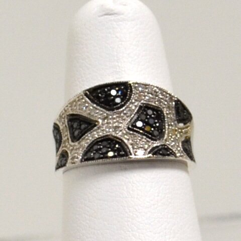 14kwg Black & White Diamond Ring: 1050.14kwg black and white diamond ring with pave diamonds .75ctw, finger size 7. 3.7gm